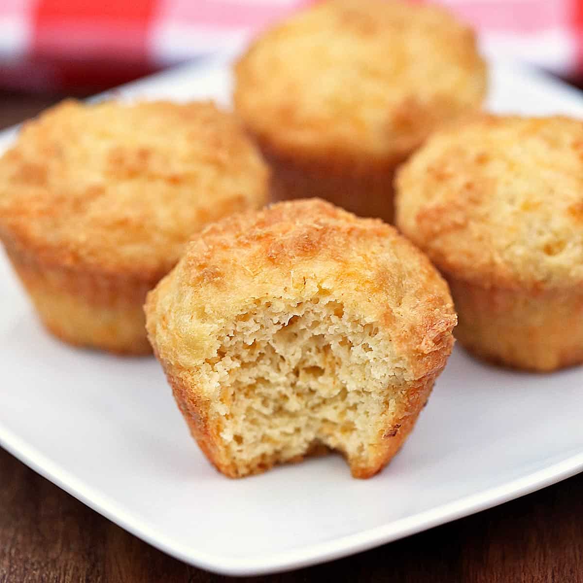 Keto cheese muffins served on a white plate.