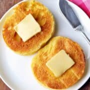 Low-carb keto English muffin topped with butter.