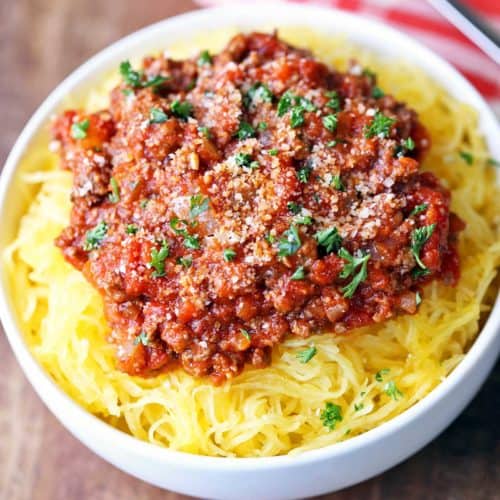 Spaghetti squash with meat sauce served in a white bowl.