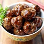 Asian meatballs are served in a bowl.