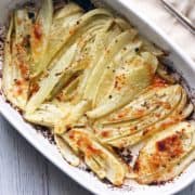 Roasted fennel in a white baking dish.