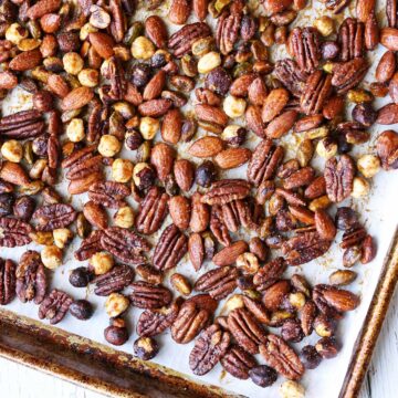 Honey roasted nuts on a baking sheet.