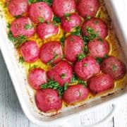 Roasted radishes in a baking dish.