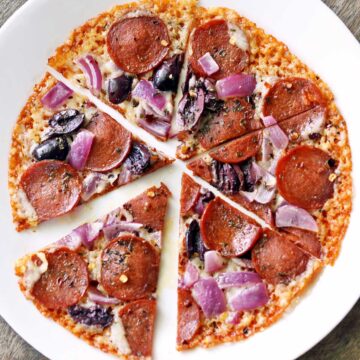 Crustless pizza on a white plate.
