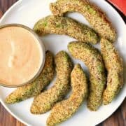 Avocado fries served with a dip.