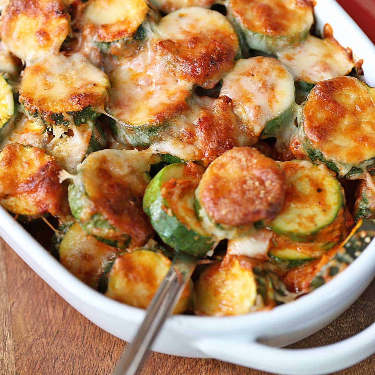 Zucchini casserole in a white baking dish.