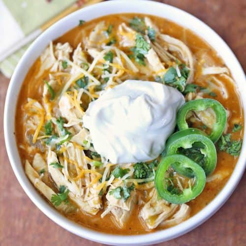 Chicken chili topped with sour cream.