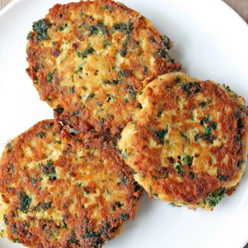 Salmon cakes served on a white plate.