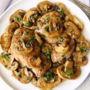 Chicken and mushrooms topped with chopped parsley.