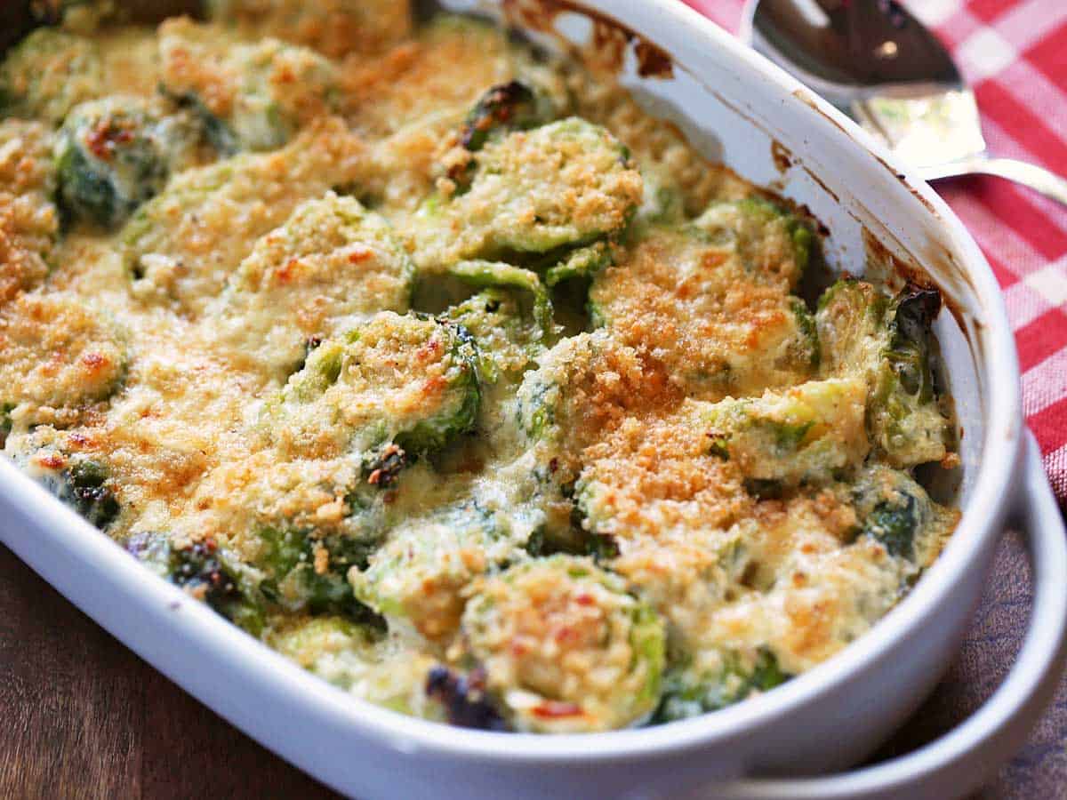 Brussels Sprouts Casserole served in a white baking dish.