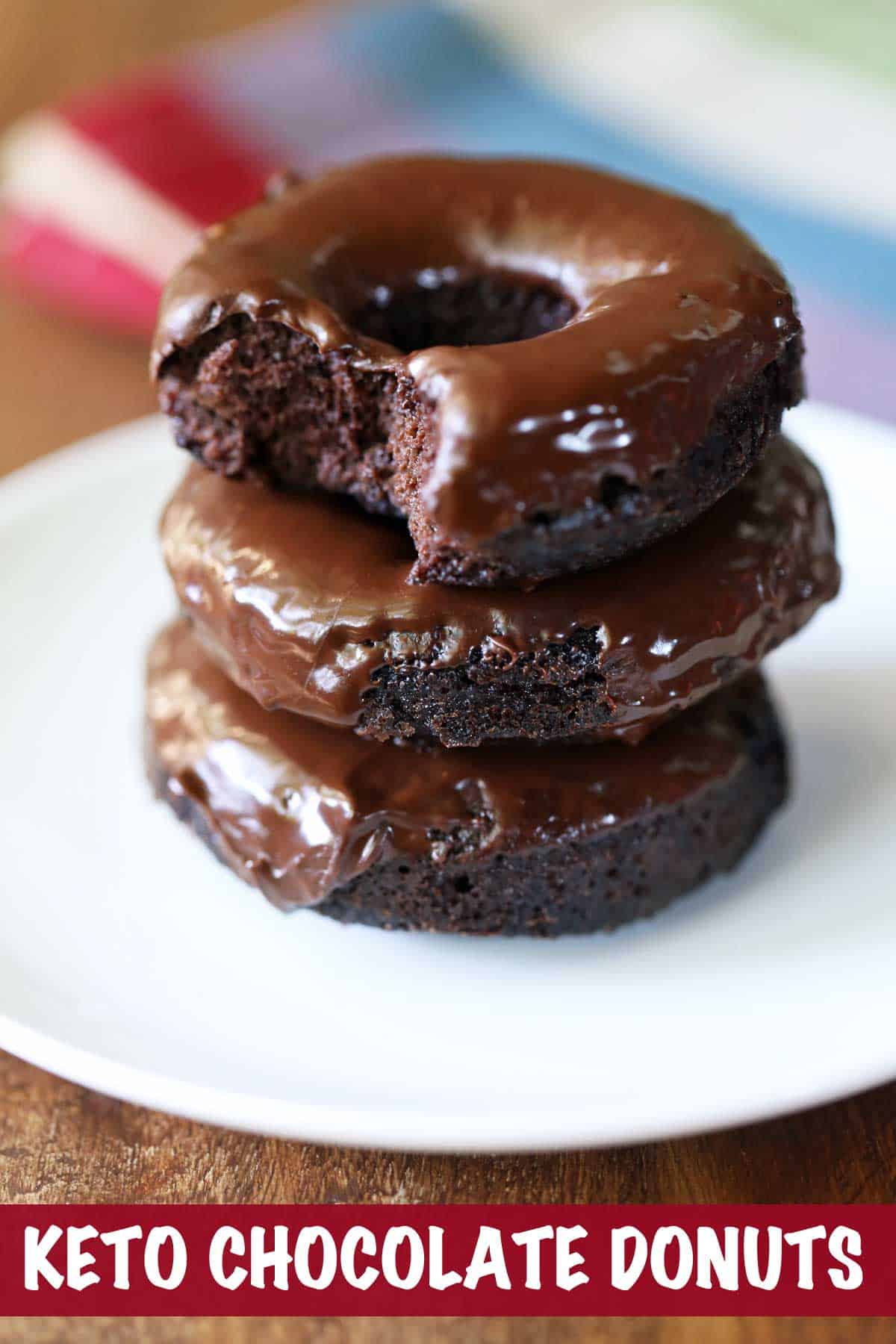 Keto chocolate donuts served on a white plate.