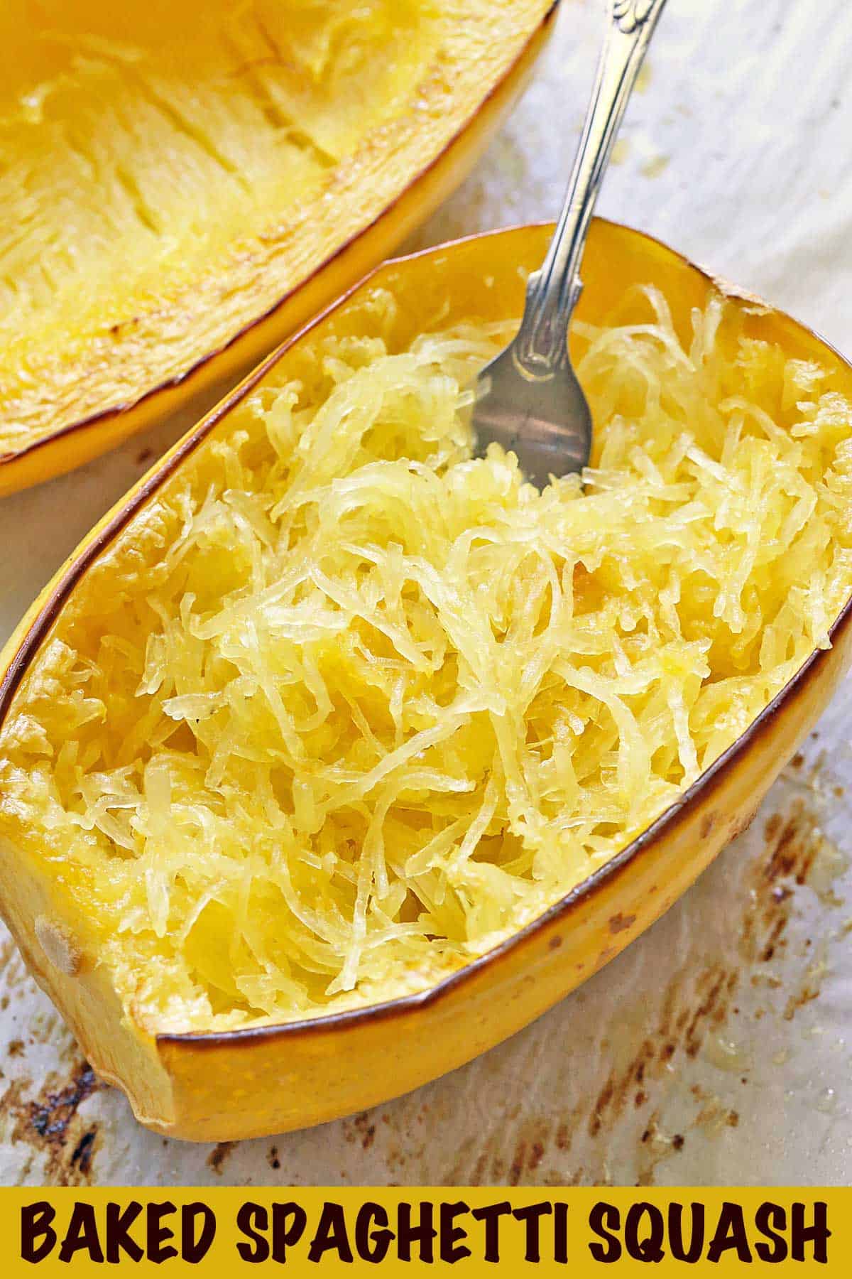 Oven-baked spaghetti squash on a baking sheet.  