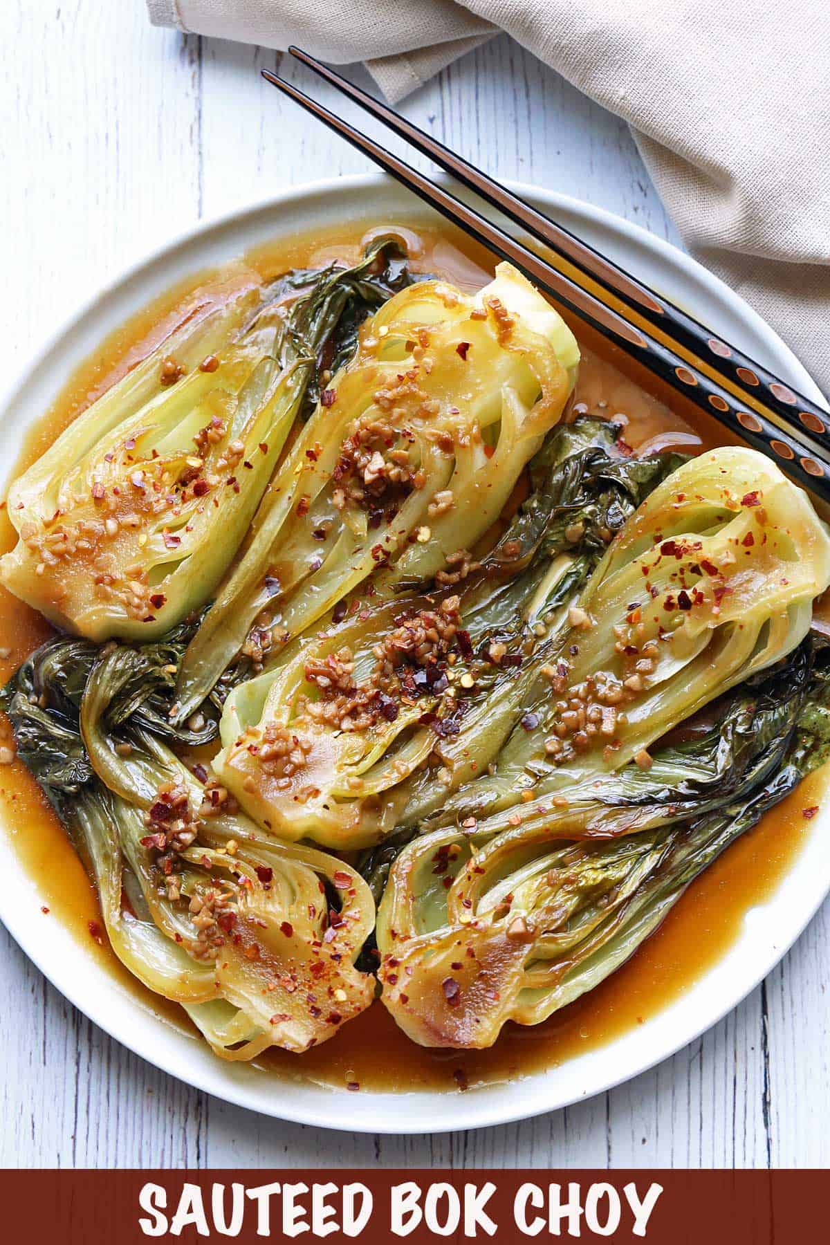 Pan-fried bok choy topped with red pepper flakes. 