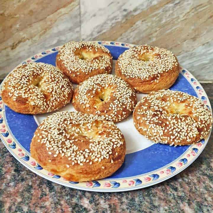 Fathead bagels made by Vered DeLeeuw dad, served on a blue and white plate.