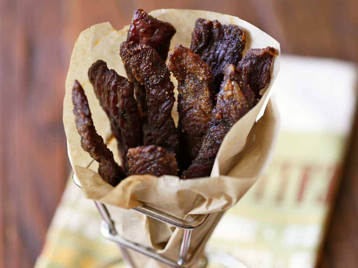 Keto beef jerky wrapped in parchment paper.