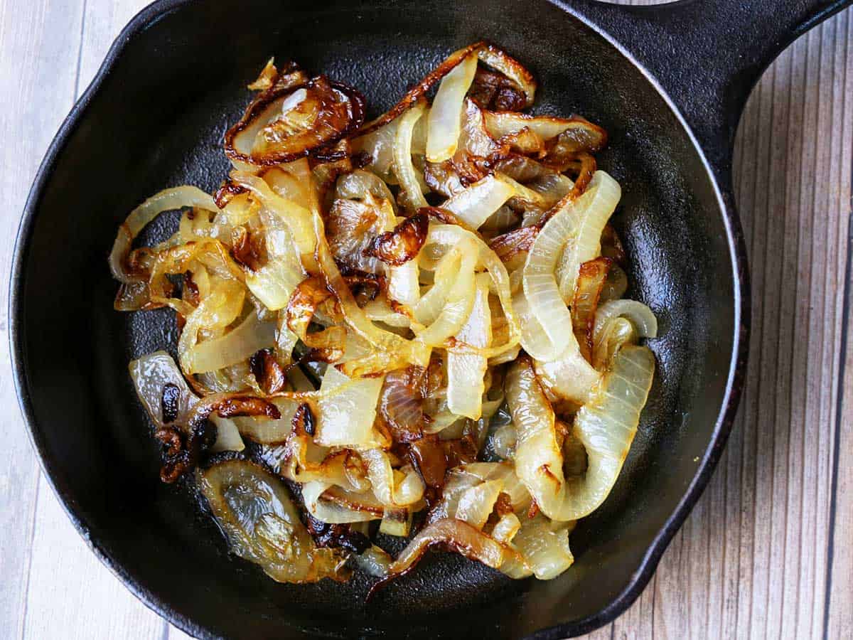Sauteed onions served in a cast-iron skillet. 
