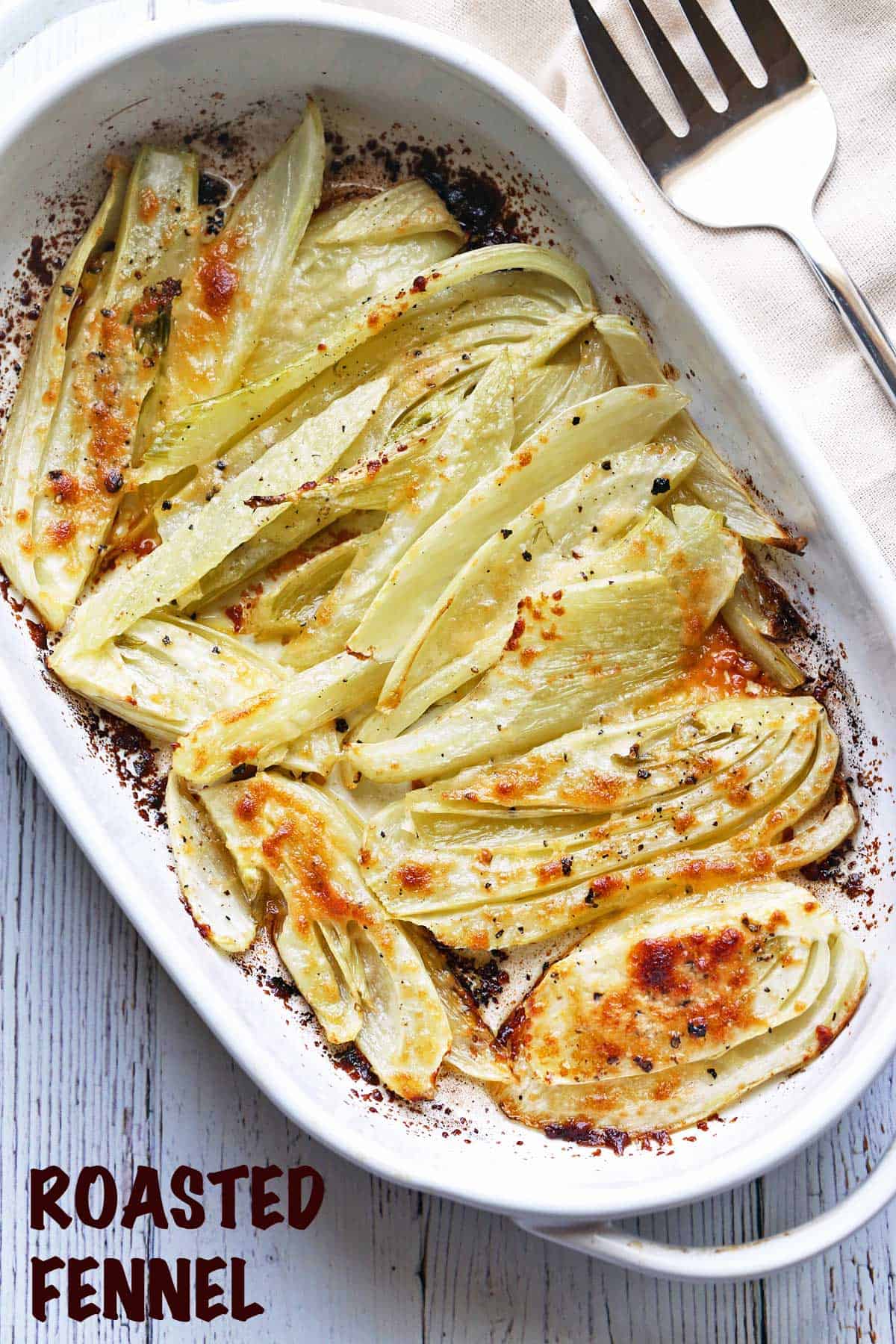 Roasted fennel served in a white baking dish. 