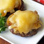 Broiled hamburgers topped with melted cheese.