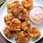 Keto chicken nuggets served with a dipping sauce.