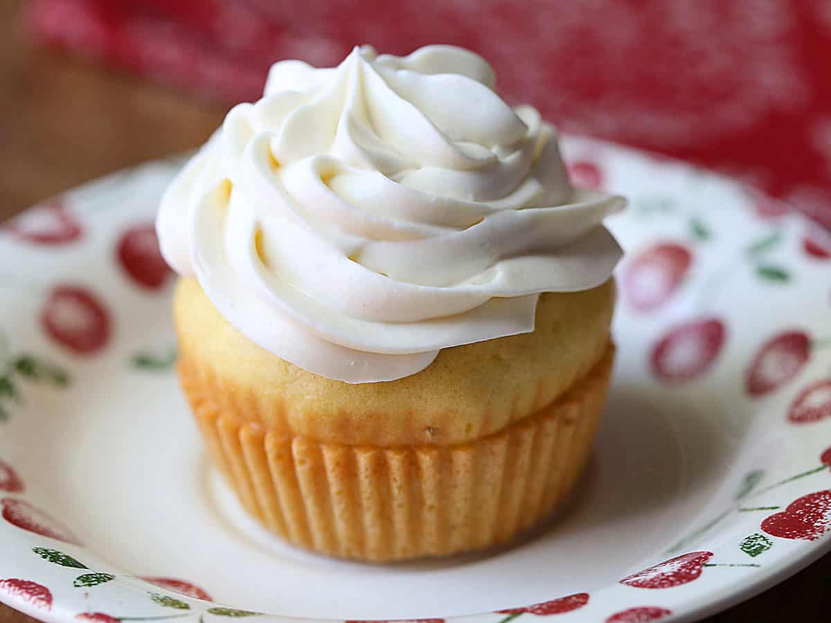 A cupcake topped with keto cream cheese frosting. 