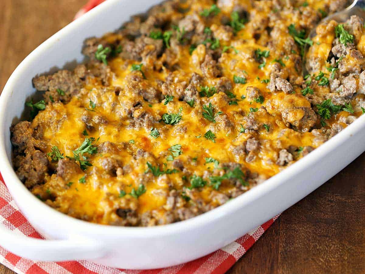 Ground beef casserole topped with cheese and parsley. 