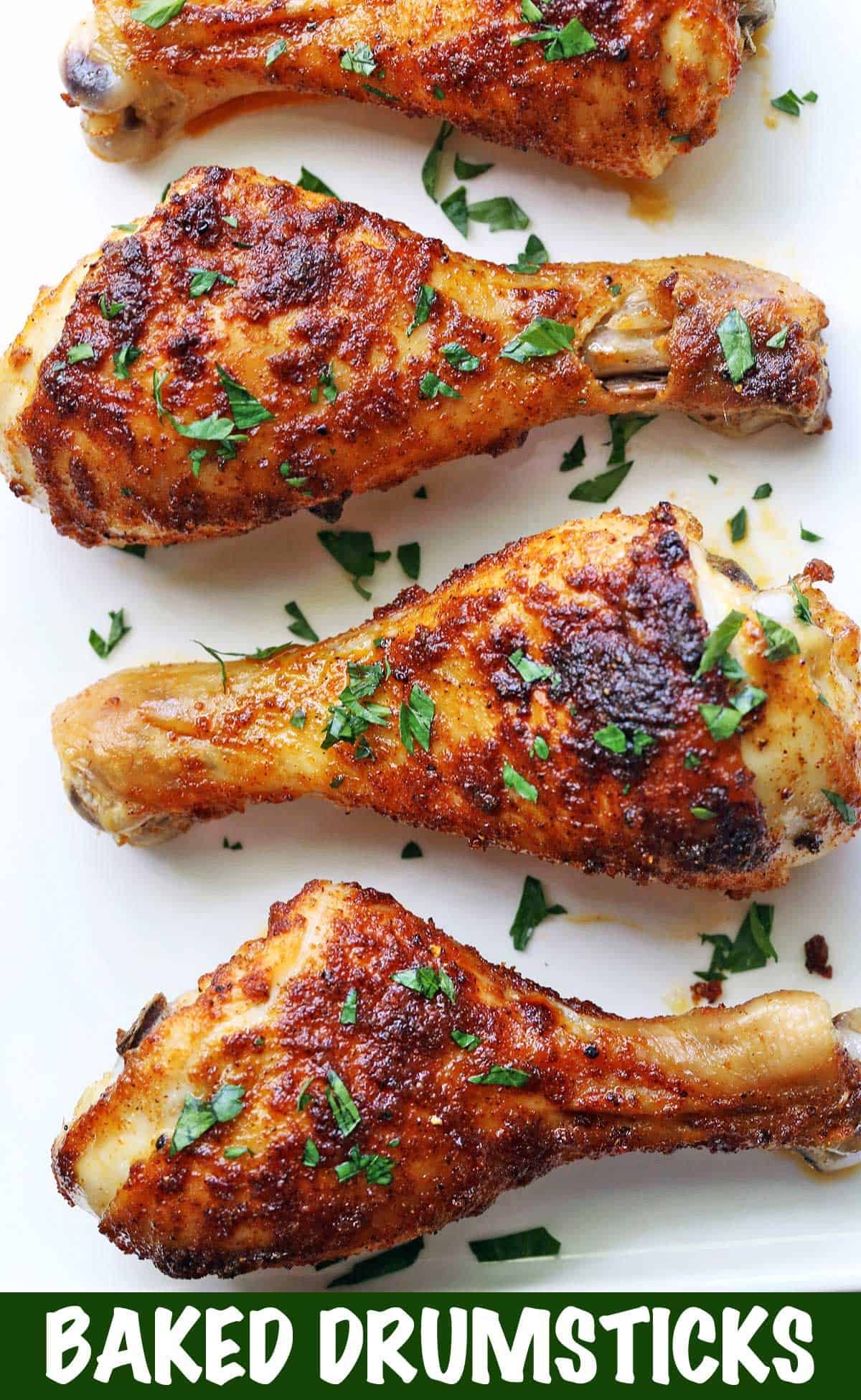 Baked drumsticks topped with chopped parsley. 