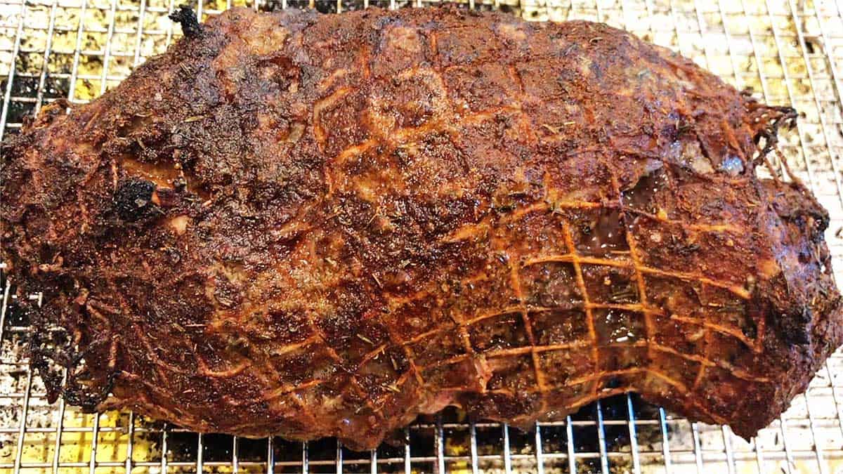 Pork roast emerges from the oven. 