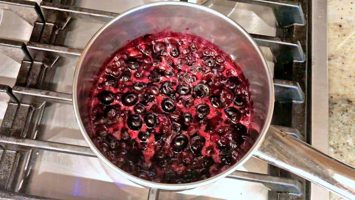 Blueberry compote is almost done cooking. 
