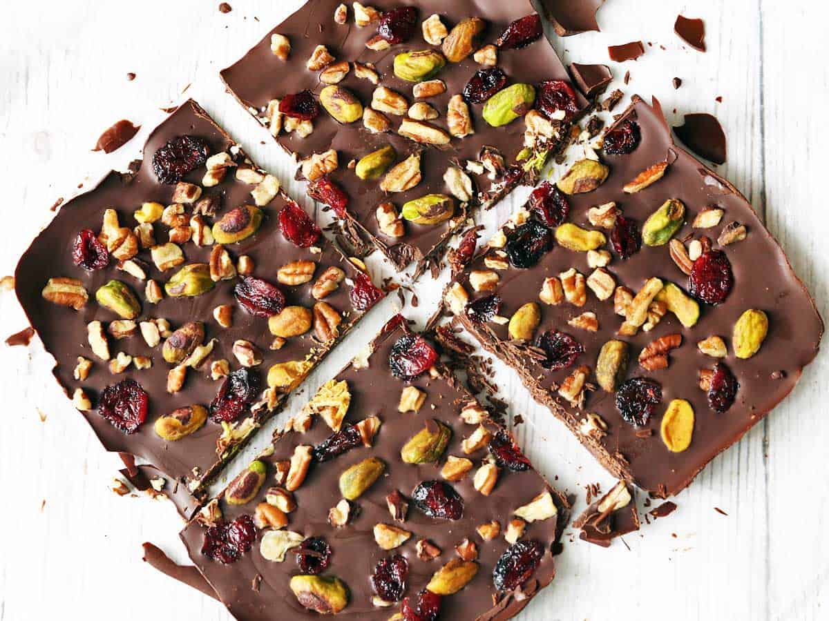 Four pieces of chocolate bark on a white background. 