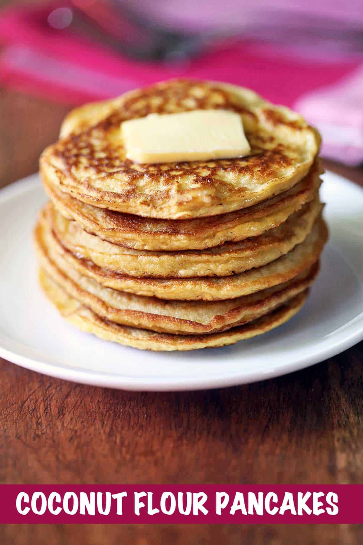 Coconut flour pancakes topped with butter. 