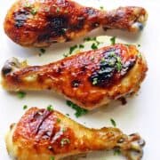 Honey garlic chicken topped with parsley.