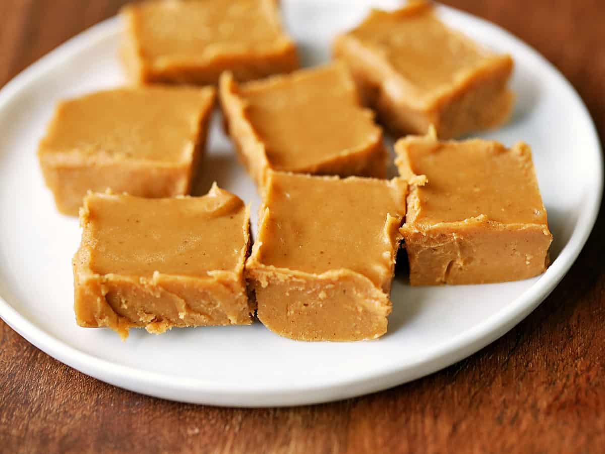 Keto peanut butter fudge squares served on a white plate. 