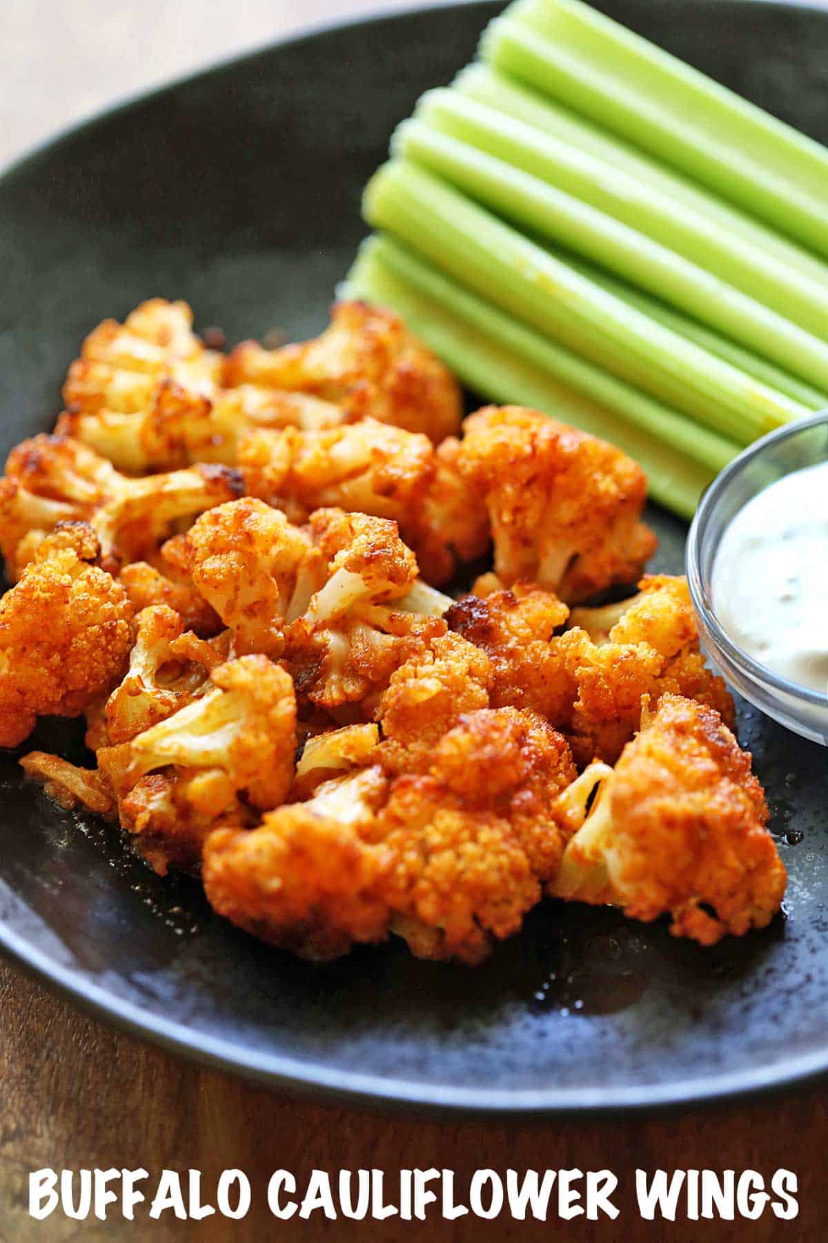 Buffalo cauliflower wings, served with celery and blue cheese dressing.