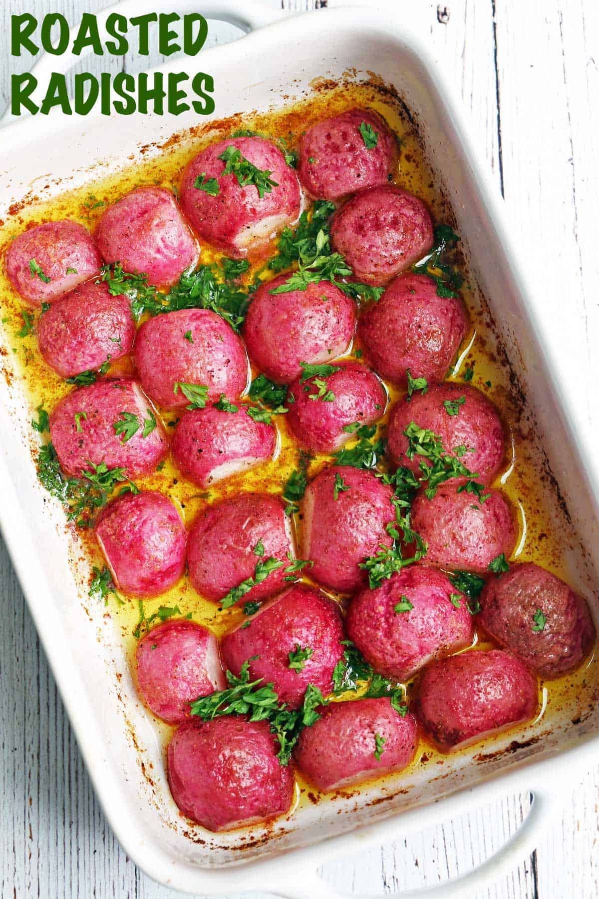 Roasted radishes served in a white baking dish. 