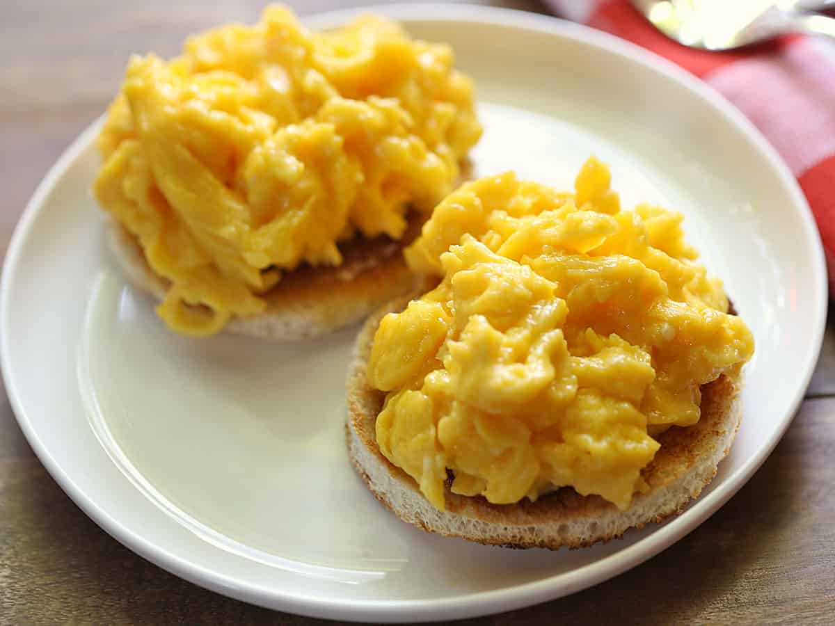 Soft scrambled eggs served on a white plate. 