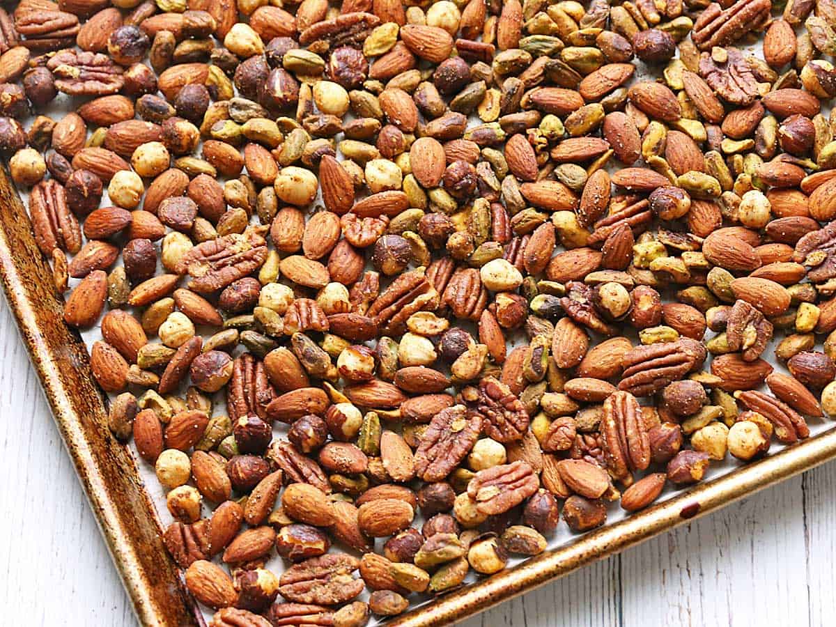 Roasted spicy nuts on a baking sheet. 