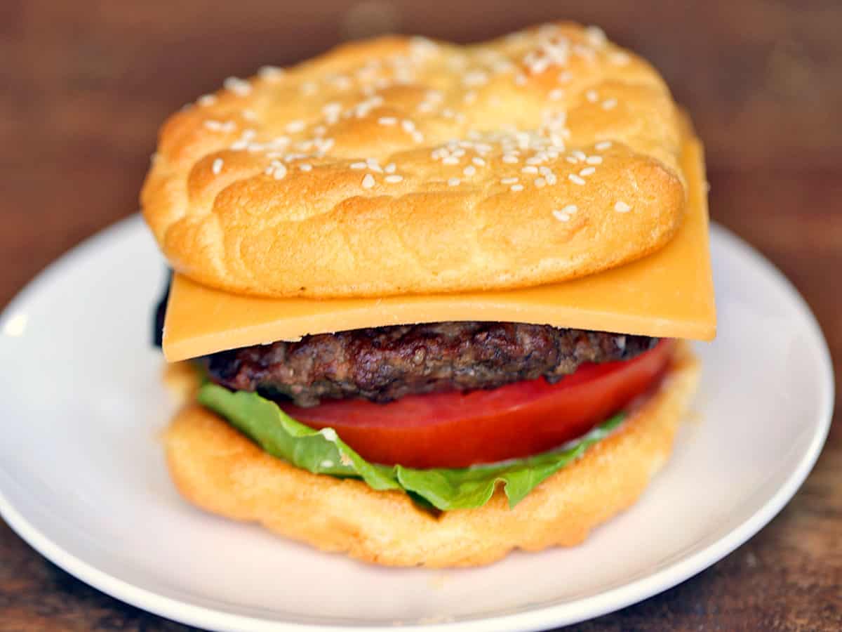 A hamburger sandwich made with oopsie bread.