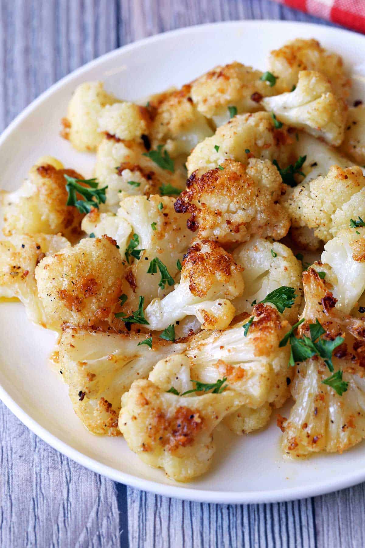 Roasted cauliflower served on a white plate. 