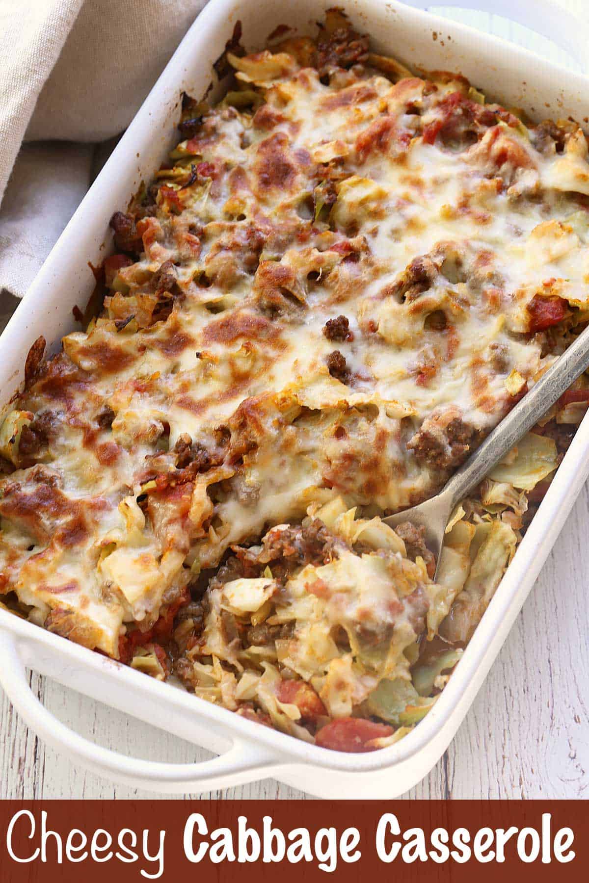 Cabbage casserole served in a white baking dish. 