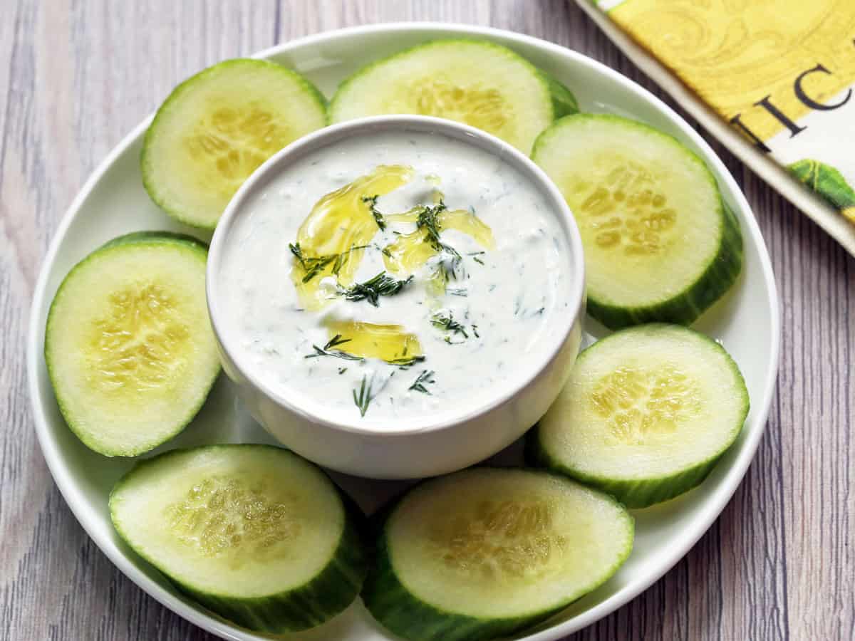 Tzatziki sauce served with cucumber slices. 