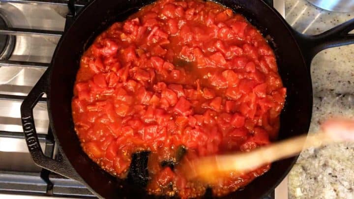 Cooking the spicy tomato sauce.