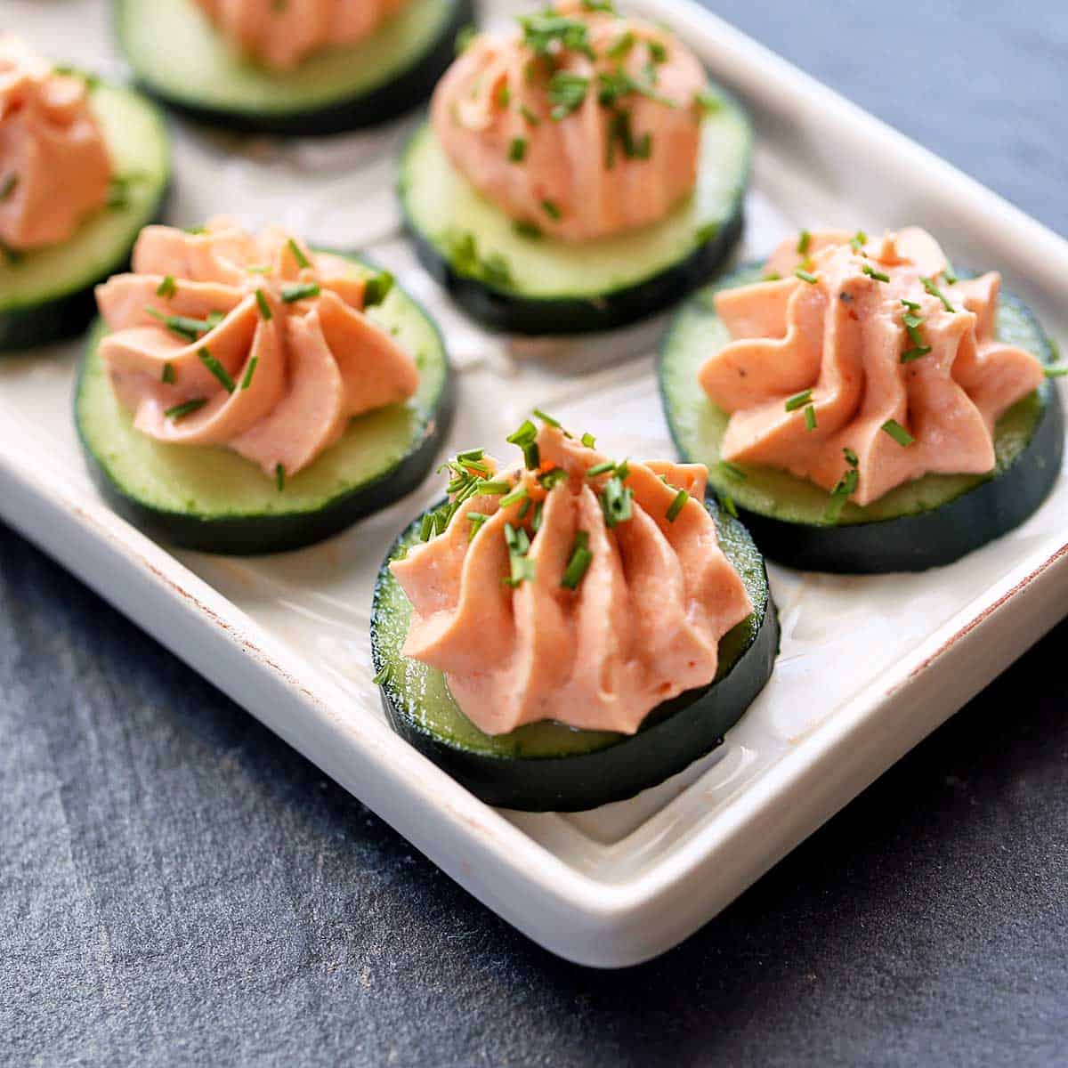 Smoked salmon mousse served on cucumber slices. 