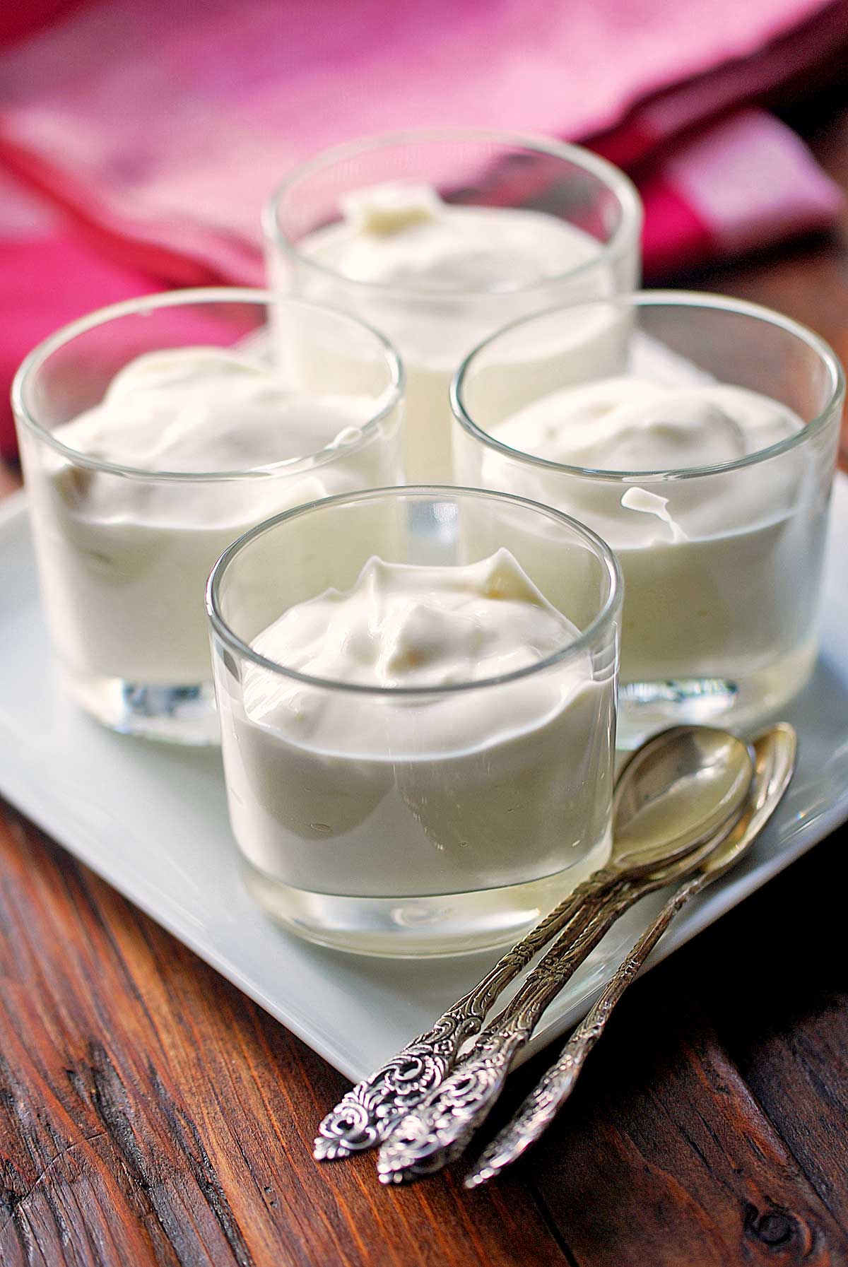 Ricotta dessert served in small cups with spoons. 