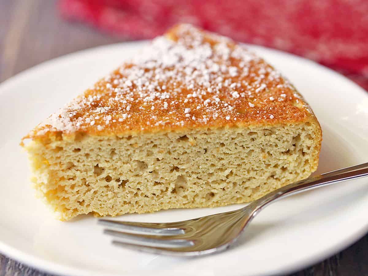 Coconut flour cake served on a plate with a fork. 