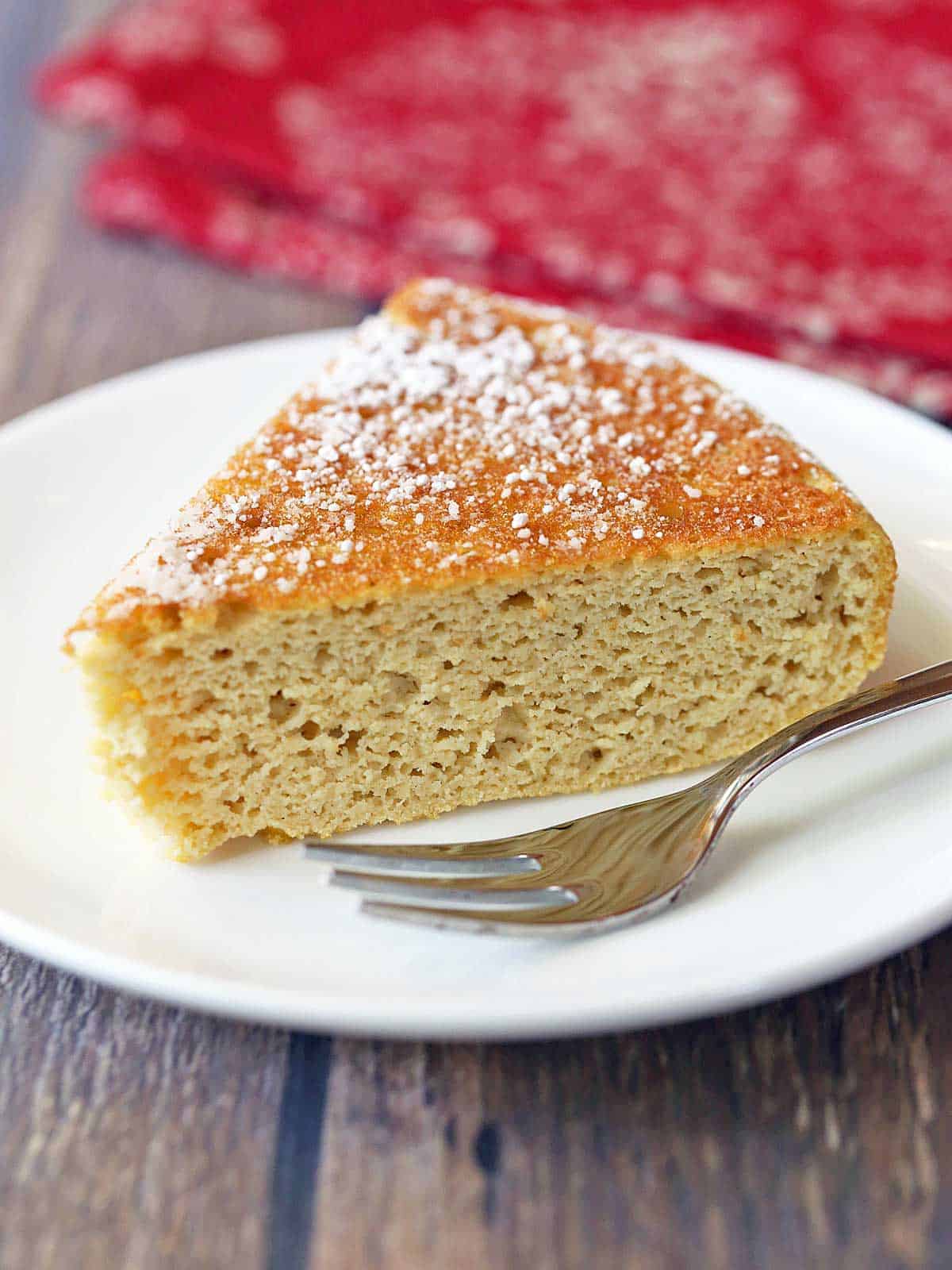 Coconut flour cake served on a plate with a fork.