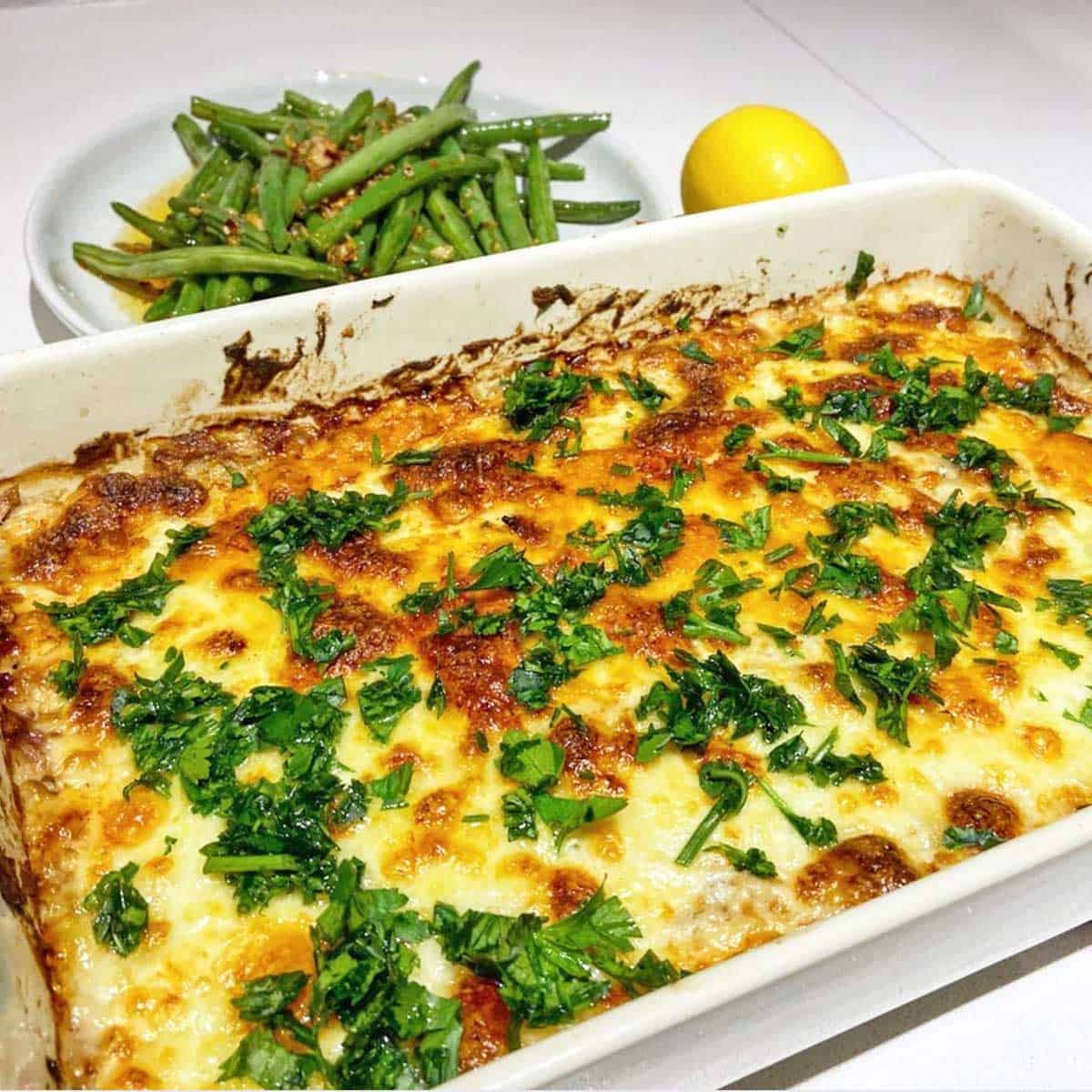 A reader photo of a keto tuna casserole with a side of green beans. 