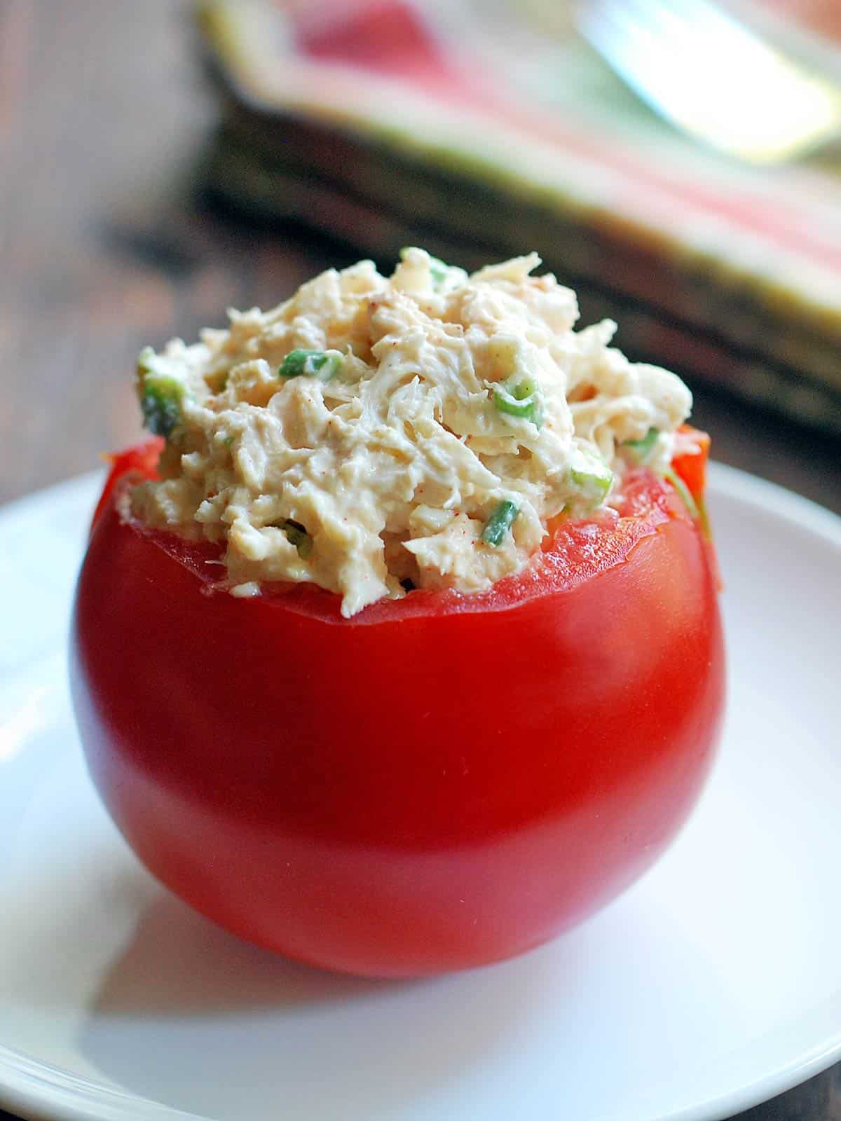 Crab salad stuffed inside a tomato. 