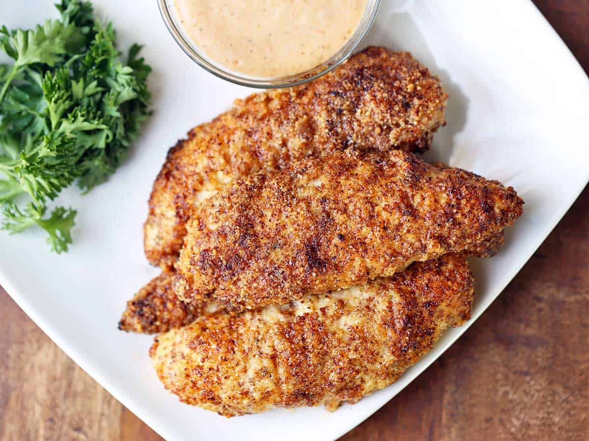 Almond flour chicken tenders served with a dipping sauce. 