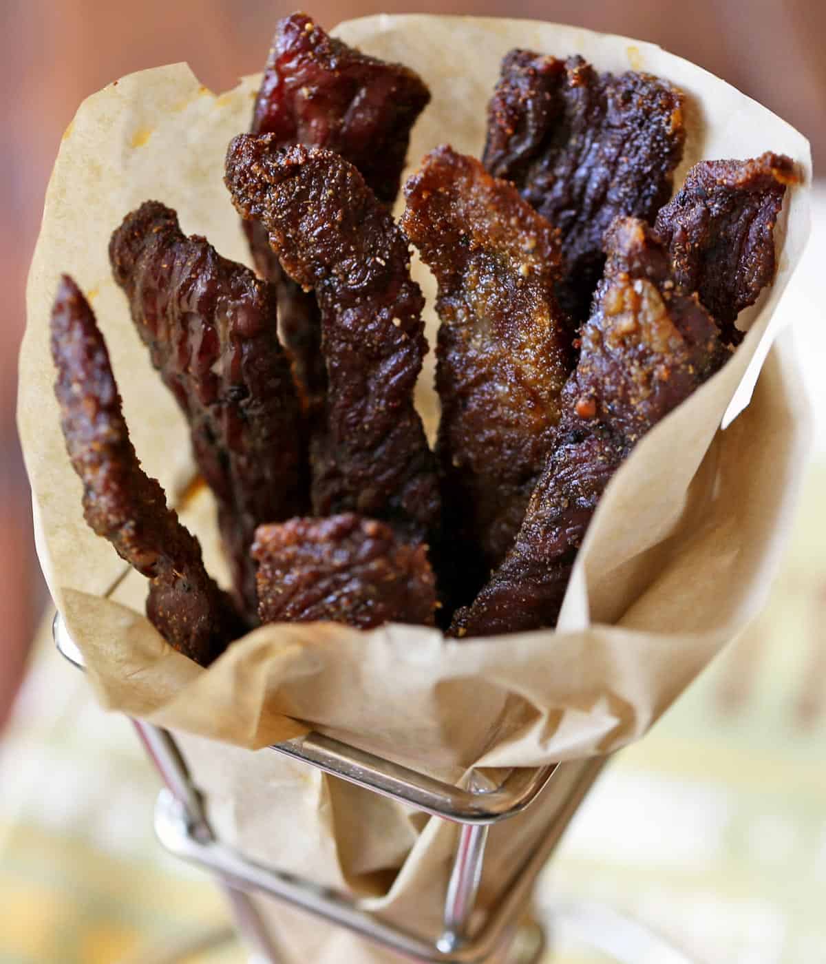 Sugar-free beef jerky wrapped in parchment paper. 