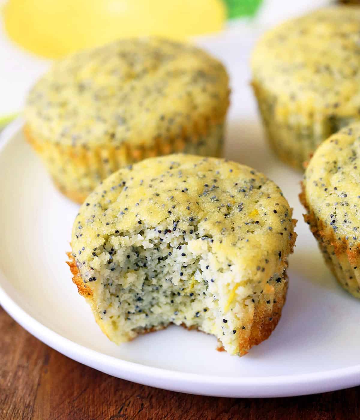 Keto lemon poppy seed muffins served on a white plate. 